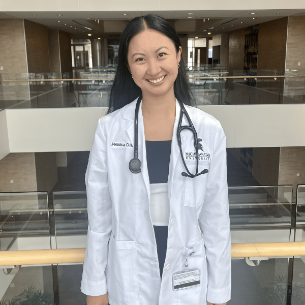 Jessica Ding posed in her white coat.